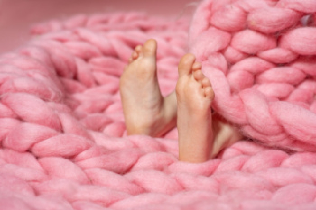 Podiatrist examining a young child's foot