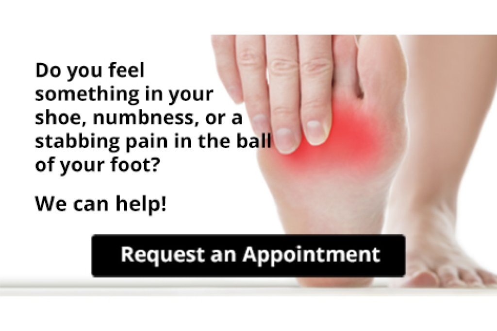 Person rubbing the ball of the foot for nerve pain