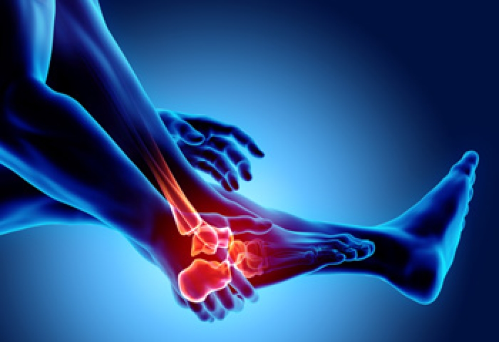 Runner holding the top of a sore foot