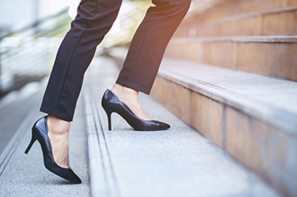 Woman's feet in a pair of high-heeled shoes